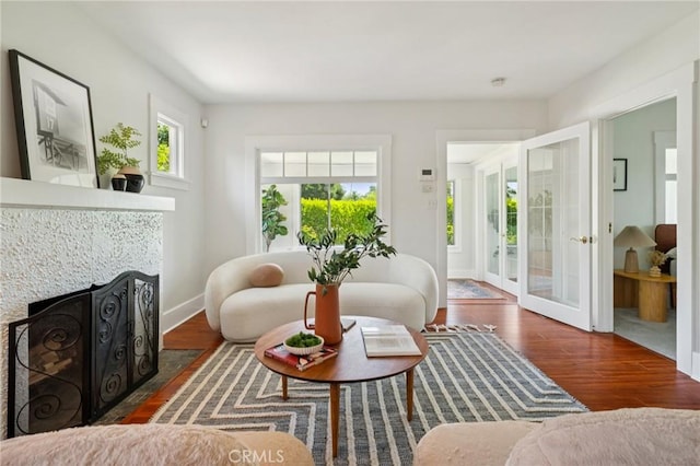 1241 Bresee Ave, Pasadena, CA 91104 - living room featuring wood finished floors, a fireplace with flush hearth, and french doors