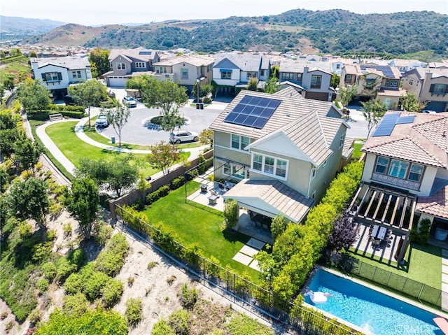 24 Granja Ct, Rancho Mission Viejo, CA 92694 - aerial perspective of suburban area with a pool and a mountain backdrop