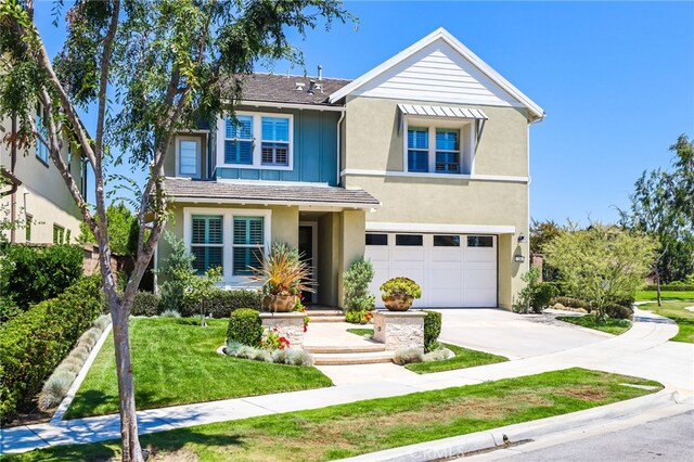 24 Granja Ct, Rancho Mission Viejo, CA 92694 - traditional home featuring concrete driveway, stucco siding, an attached garage, and a front yard