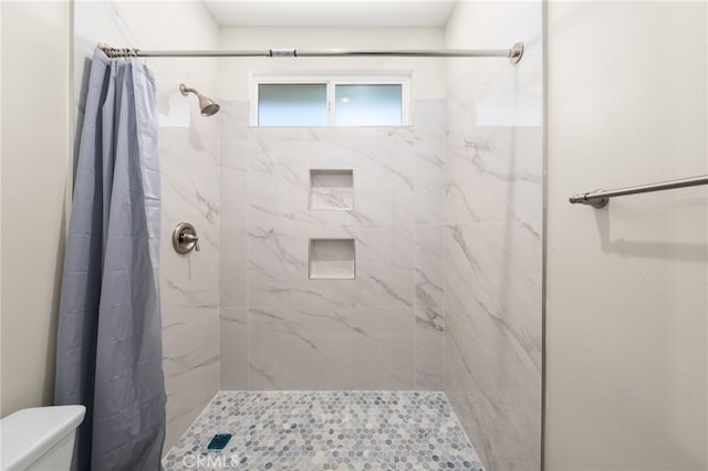 1239 Ansley Ln, Mentone, CA 92359 - full bathroom featuring toilet and a marble finish shower