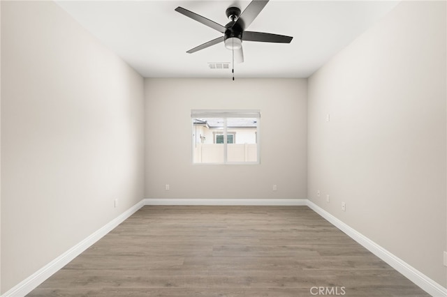 1239 Ansley Ln, Mentone, CA 92359 - empty room with wood finished floors and ceiling fan