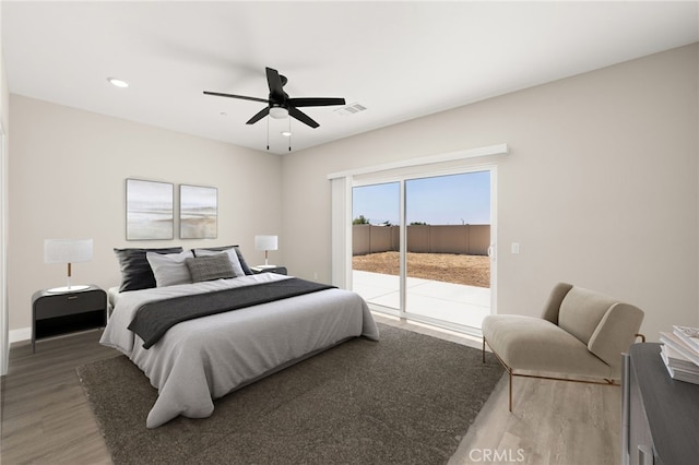 1239 Ansley Ln, Mentone, CA 92359 - bedroom featuring light wood finished floors, access to exterior, ceiling fan, and recessed lighting