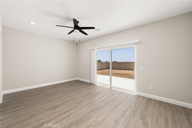 1239 Ansley Ln, Mentone, CA 92359 - spare room featuring wood finished floors, ceiling fan, and recessed lighting