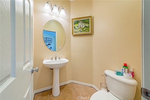 25238 Gloriso Ln, Stevenson Ranch, CA 91381 - bathroom with toilet, baseboards, and tile patterned flooring