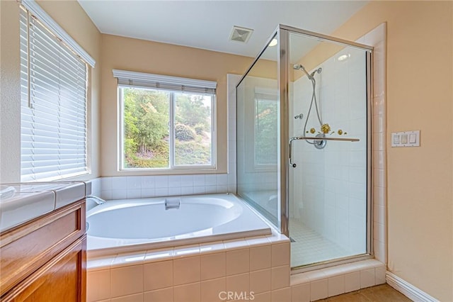 25238 Gloriso Ln, Stevenson Ranch, CA 91381 - bathroom featuring a shower stall, a bath, and tile patterned floors