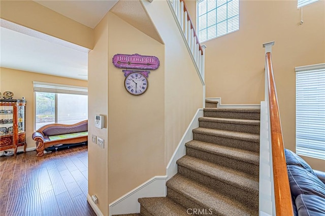 25238 Gloriso Ln, Stevenson Ranch, CA 91381 - stairs with baseboards and wood finished floors