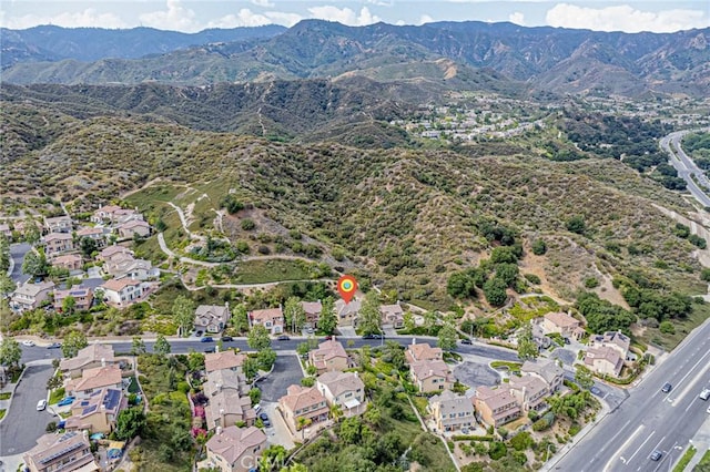 25238 Gloriso Ln, Stevenson Ranch, CA 91381 - aerial view of property's location featuring a mountain backdrop and nearby suburban area