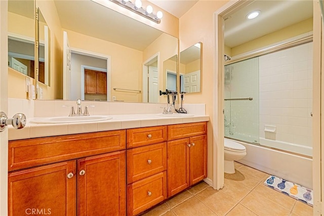 25238 Gloriso Ln, Stevenson Ranch, CA 91381 - bathroom with toilet, tile patterned flooring, double vanity, and bath / shower combo with glass door