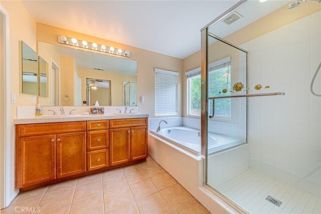 25238 Gloriso Ln, Stevenson Ranch, CA 91381 - full bathroom with tile patterned flooring, double vanity, a garden tub, a stall shower, and a ceiling fan