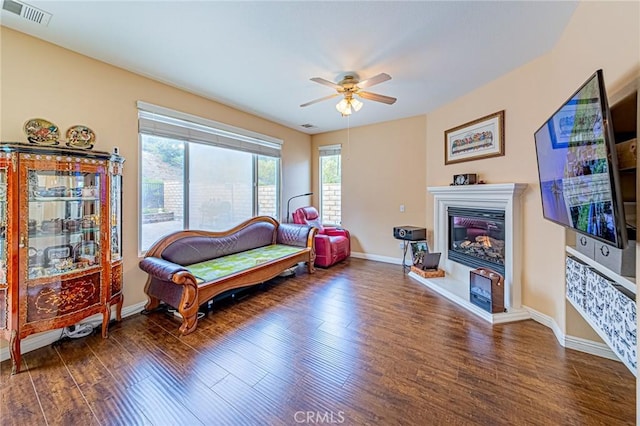 25238 Gloriso Ln, Stevenson Ranch, CA 91381 - sitting room featuring wood finished floors, ceiling fan, baseboards, and a glass covered fireplace