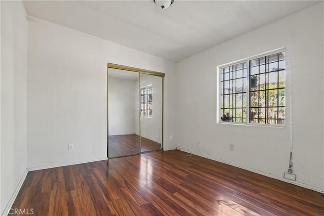 1419 S Redondo Blvd, Los Angeles, CA 90019 - unfurnished bedroom featuring wood finished floors and a closet