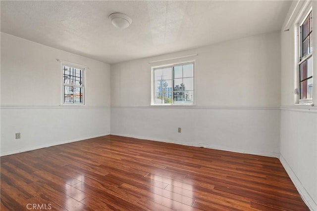 1419 S Redondo Blvd, Los Angeles, CA 90019 - empty room with wood finished floors and baseboards