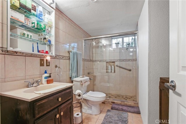 1419 S Redondo Blvd, Los Angeles, CA 90019 - bathroom with a shower stall, toilet, vanity, tile patterned floors, and a textured ceiling