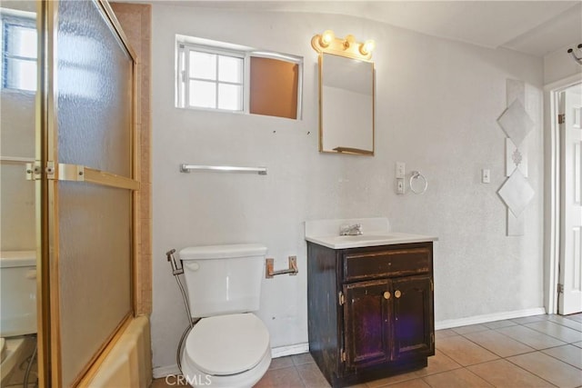 1419 S Redondo Blvd, Los Angeles, CA 90019 - bathroom with toilet, tile patterned floors, vanity, baseboards, and bath / shower combo with glass door