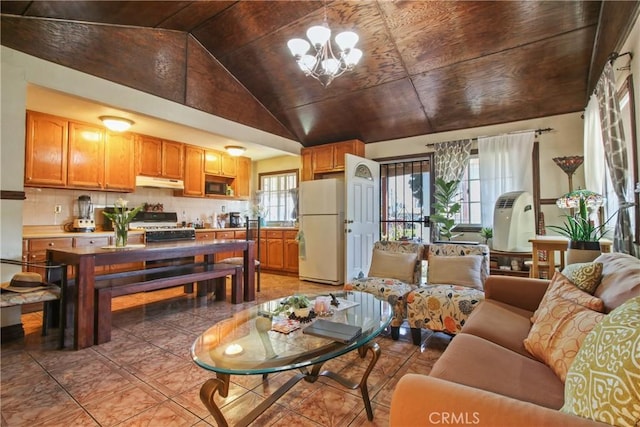 1419 S Redondo Blvd, Los Angeles, CA 90019 - living area with lofted ceiling, light tile patterned floors, and a chandelier