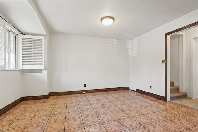 1419 S Redondo Blvd, Los Angeles, CA 90019 - spare room with baseboards and stairs