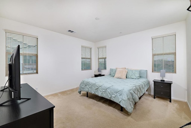 1923 Corte Zafiro Unit 170, Chula Vista, CA 91913 - bedroom featuring light carpet, multiple windows, and baseboards
