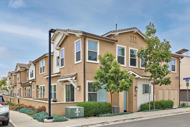 1923 Corte Zafiro Unit 170, Chula Vista, CA 91913 - multi unit property with stucco siding, a residential view, and central AC unit