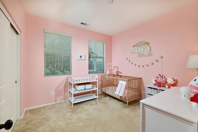 1923 Corte Zafiro Unit 170, Chula Vista, CA 91913 - bedroom with light carpet, a closet, a nursery area, and baseboards