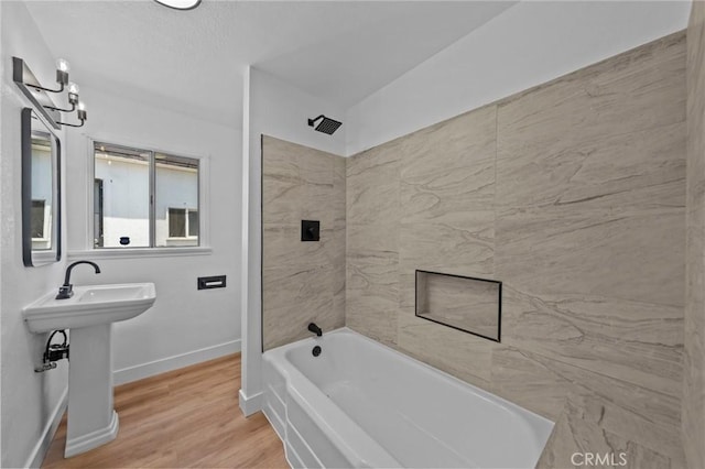 24576 4th St, San Bernardino, CA 92410 - full bathroom featuring bathtub / shower combination, baseboards, and wood finished floors