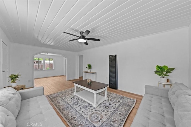24576 4th St, San Bernardino, CA 92410 - living area with a heating unit, light wood-style flooring, arched walkways, a ceiling fan, and wood ceiling