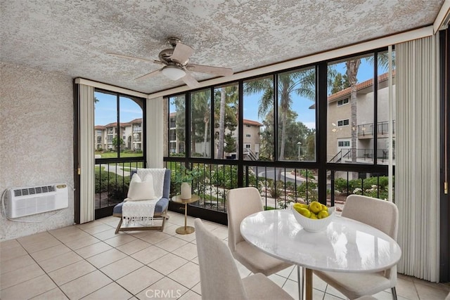 3241 San Amadeo Unit 1G, Laguna Woods, CA 92637 - sunroom featuring a wall of windows, tile patterned flooring, and a wall unit AC