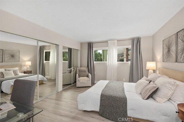 3241 San Amadeo Unit 1G, Laguna Woods, CA 92637 - bedroom featuring wood finished floors