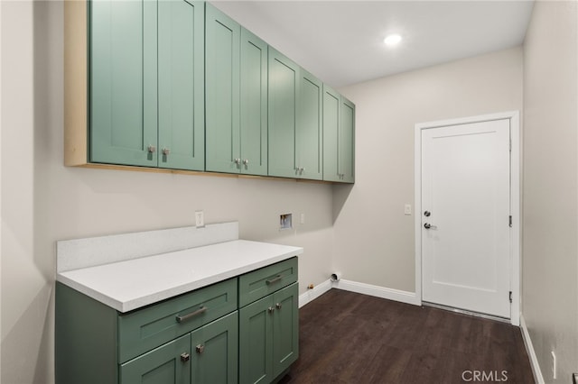 1243 Ansley Ln, Mentone, CA 92359 - laundry area featuring cabinet space, hookup for a washing machine, dark wood-style floors, and recessed lighting