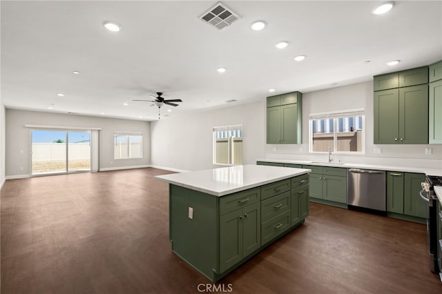 1243 Ansley Ln, Mentone, CA 92359 - kitchen featuring green cabinets, appliances with stainless steel finishes, ceiling fan, light countertops, and recessed lighting