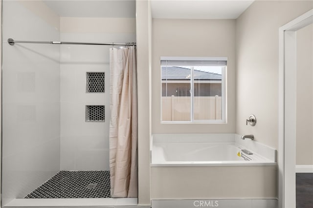 1243 Ansley Ln, Mentone, CA 92359 - bathroom featuring a garden tub and a tile shower