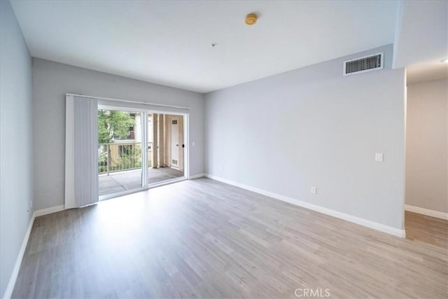 31241 Taylor Ln, Temecula, CA 92592 - empty room with wood finished floors, baseboards, and a smoke detector