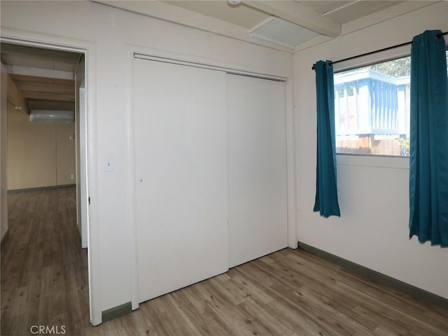 11579 Widgeon Way, Clearlake Oaks, CA 95423 - unfurnished bedroom with wood finished floors and a closet