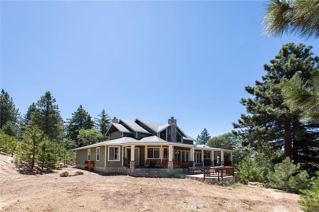 32557 Pine Cone Ct Unit A & B, Running Springs, CA 92382 - back of property with a chimney and a deck