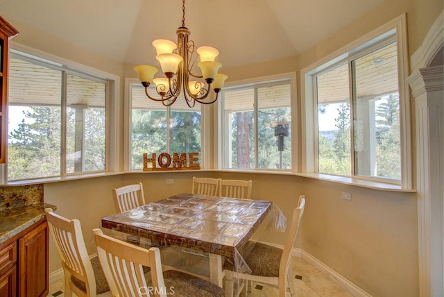 32557 Pine Cone Ct Unit A & B, Running Springs, CA 92382 - dining area with vaulted ceiling, baseboards, plenty of natural light, and a chandelier