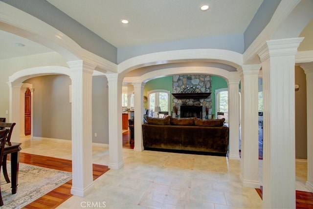 32557 Pine Cone Ct Unit A & B, Running Springs, CA 92382 - living area featuring a fireplace, arched walkways, recessed lighting, and decorative columns