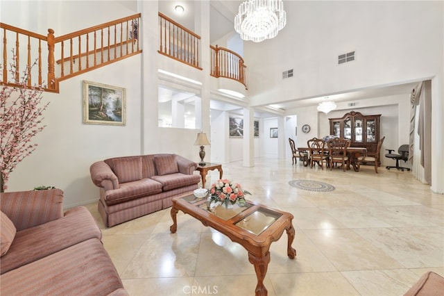 12830 Wildflower Ln, Riverside, CA 92503 - tiled living room with a high ceiling and a chandelier