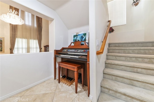 12830 Wildflower Ln, Riverside, CA 92503 - stairway with tile patterned floors, baseboards, vaulted ceiling, and a chandelier
