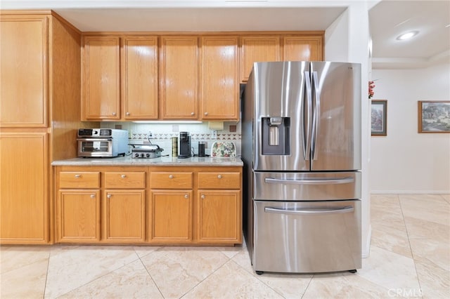 12830 Wildflower Ln, Riverside, CA 92503 - kitchen featuring stainless steel refrigerator with ice dispenser, recessed lighting, brown cabinets, light tile patterned floors, and baseboards