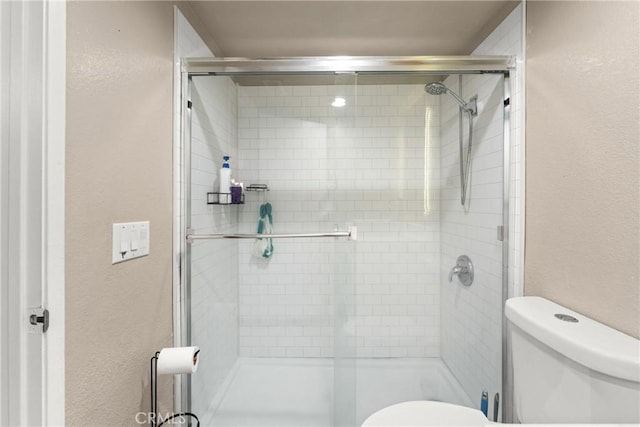 1149 Cochise Ct, Vista, CA 92084 - full bath with toilet, a textured wall, and a stall shower