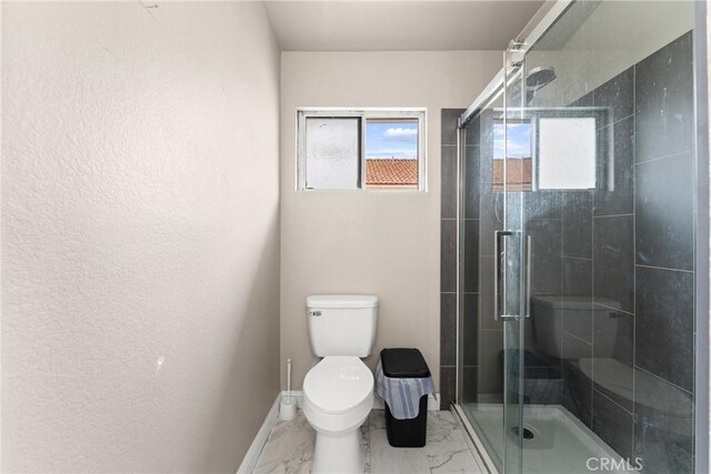 1149 Cochise Ct, Vista, CA 92084 - bathroom with toilet, marble look tile flooring, and a stall shower