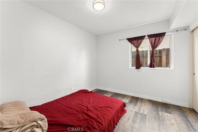 1149 Cochise Ct, Vista, CA 92084 - bedroom featuring wood finished floors and baseboards