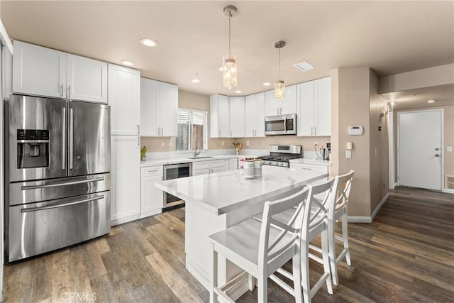 1149 Cochise Ct, Vista, CA 92084 - kitchen featuring stainless steel appliances, wine cooler, a sink, dark wood-style floors, and light countertops