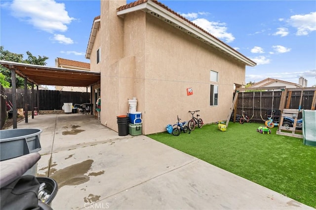 1149 Cochise Ct, Vista, CA 92084 - view of home's exterior with stucco siding and a patio area
