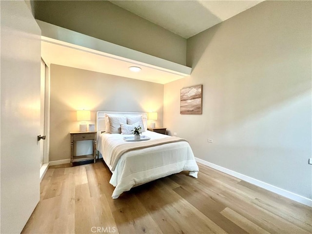 13580 Medinac Ln Unit M5-E, Seal Beach, CA 90740 - bedroom featuring baseboards and wood finished floors