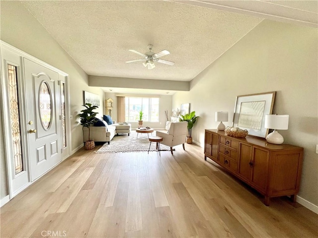 13580 Medinac Ln Unit M5-E, Seal Beach, CA 90740 - foyer featuring a ceiling fan, light wood-style floors, a textured ceiling, and baseboards