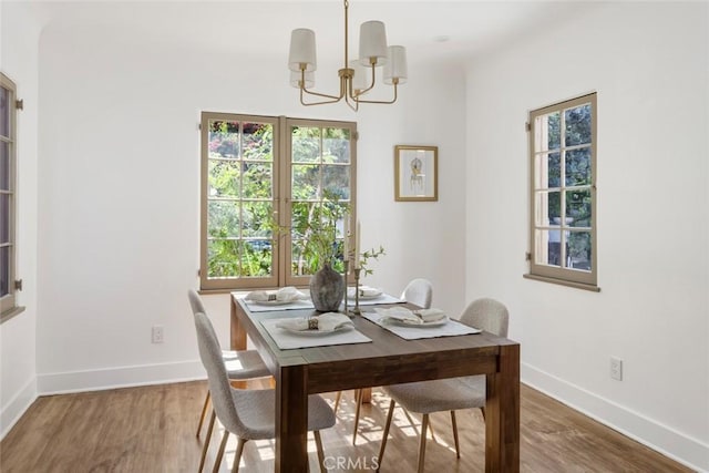2376 Lake View Ave, Los Angeles, CA 90039 - dining area featuring a chandelier and wood finished floors