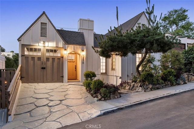 2376 Lake View Ave, Los Angeles, CA 90039 - view of front of house featuring roof with shingles, board and batten siding, and a chimney