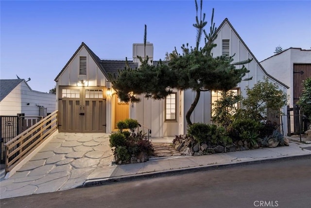 2376 Lake View Ave, Los Angeles, CA 90039 - english style home with driveway, an attached garage, and a chimney
