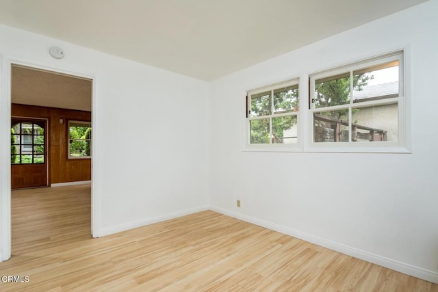 2238 Garfias Dr, Pasadena, CA 91104 - spare room with wood finished floors, baseboards, and a smoke detector