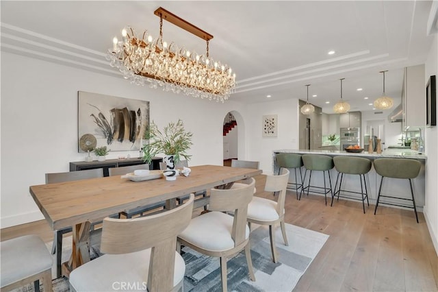 1812 Linda Vista Ave, Pasadena, CA 91103 - dining space with arched walkways, light wood-style flooring, recessed lighting, a raised ceiling, and baseboards